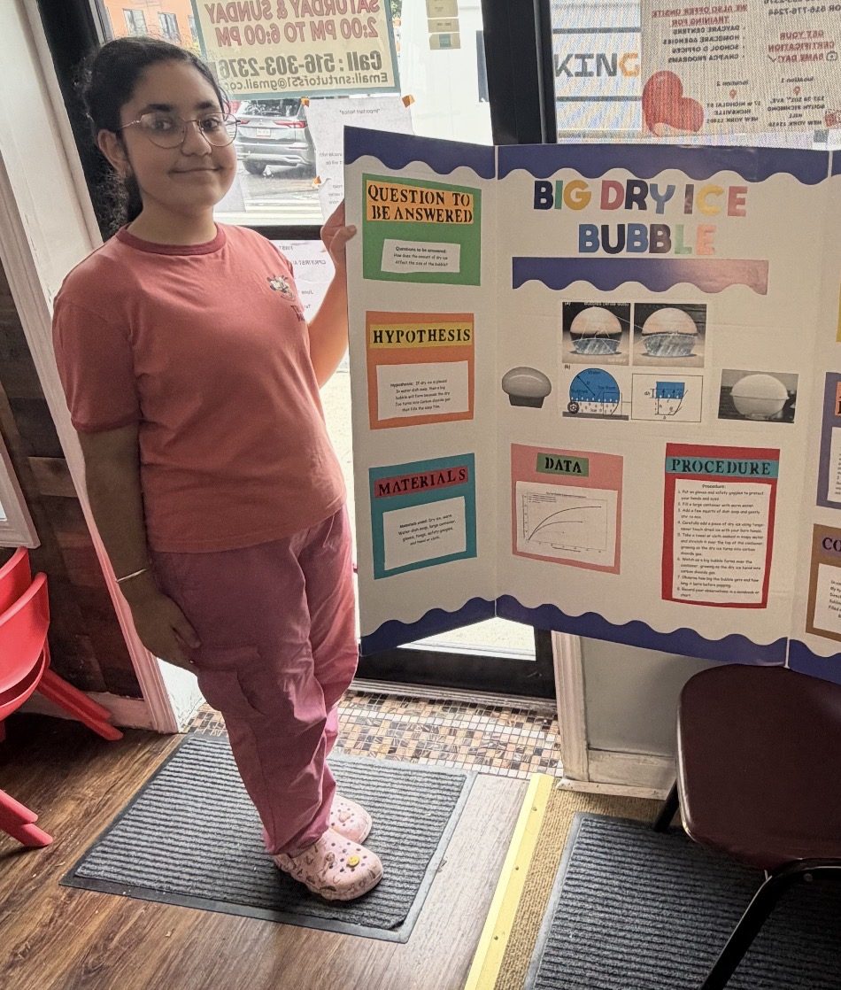 An SNR Tutors student presenting her science fair project